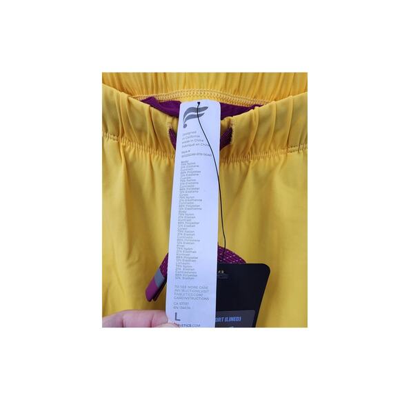 New NWT Fabletics The 7" One Short Lined Athletic Short Size Large Yellow Orange - Picture 8 of 9